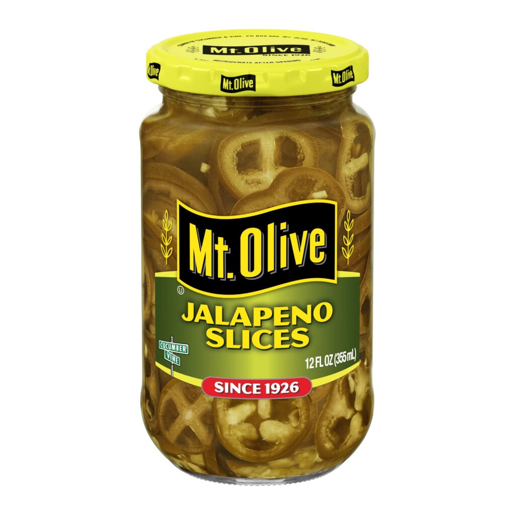 Jar of Mt Olive Jalapeno Slices with peppers inside.
