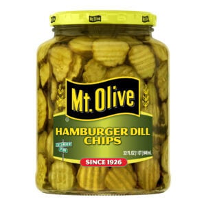 Jar of Mt Olive Hamburger Dill Chips with yellow lid and label.