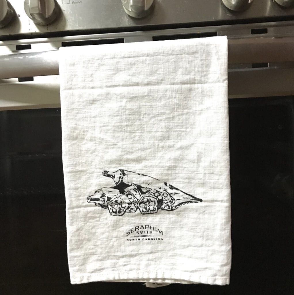 Artist towel featuring a bear illustration and signature by Seraphim Smith.