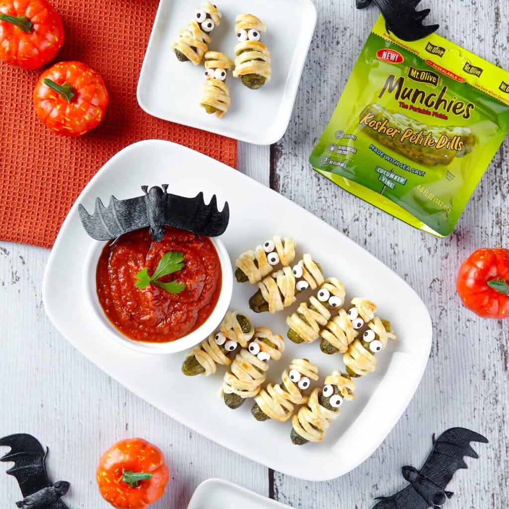 Halloween-themed Munchies Mummies with tomato sauce and decorative bats.