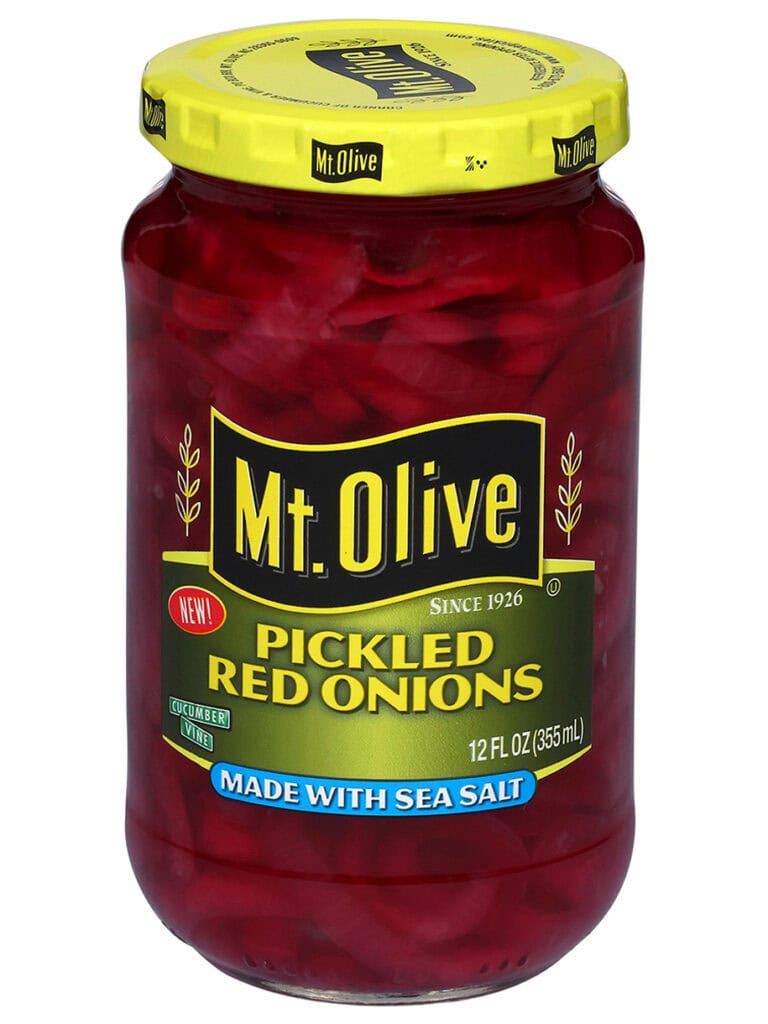 A jar of Mt. Olive Pickled red onions sits against a white backdrop.